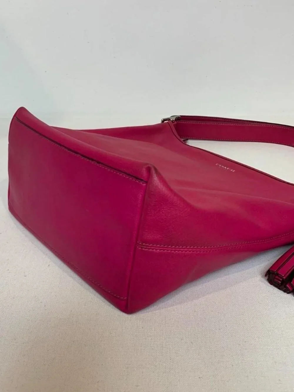 Vibrant fuchsia pink Coach Legacy leather